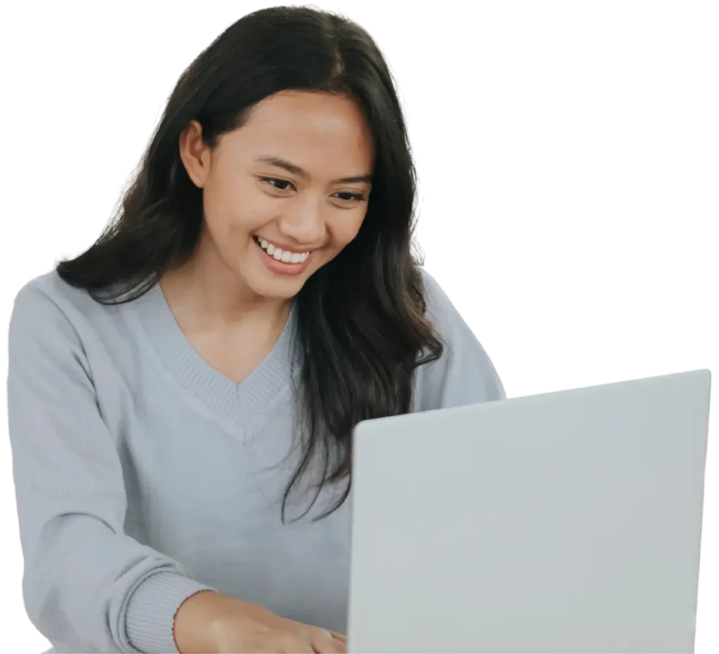 Happy woman using laptop to make NDIS referral